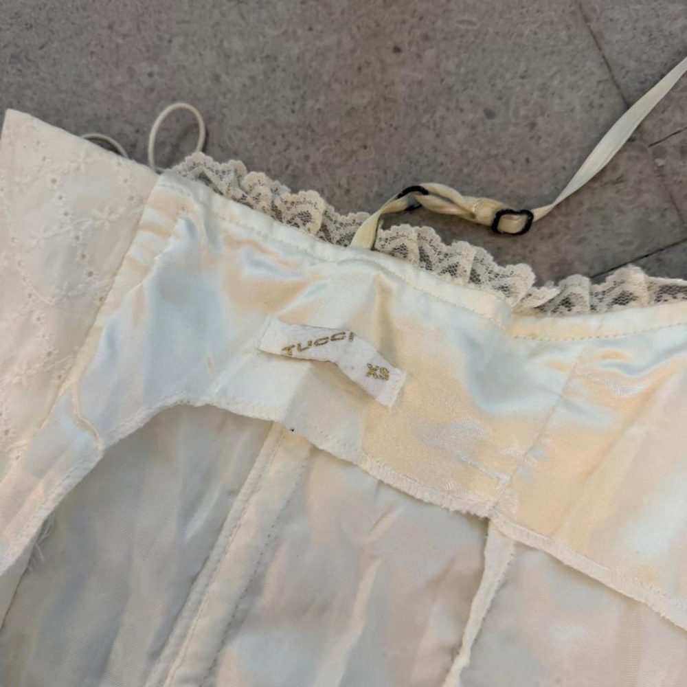 Vintage Tucci, Argentinian designer, white lace corset top with lace trim and ad